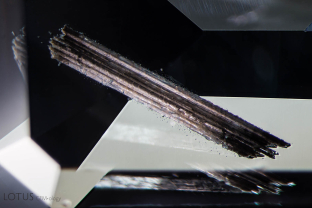 This cluster of large tubes was cut through on both ends inside of a spinel. Specimen courtesy of Global Spinel Gems.
