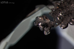 Inside this spinel a cluster of irregular, high relief crystals stands out. Specimen courtesy Global Spinel Gems.
