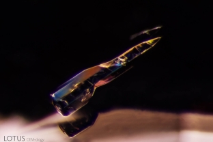 A rocket-shaped crystal takes flight within this sapphire from Sri Lanka.