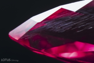 Elongated, flat needles can be seen in this Mahenge spinel.