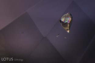 This conical crystal displays interference colors when viewed in crossed polars.