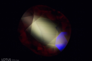 When observed under shortwave UV fluorescent light, this zircon displays an obvious yellow fluorescence with angular zoning.