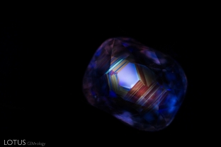 Seeing the chalky hexagonal banding in shortwave UV light reveals that this sapphire from Burma was heated. Photo taken with M&A Instruments Deep-UV Fluorescence system.
