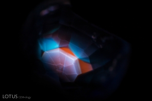 Seeing the chalky hexagonal banding in shortwave UV light reveals that this sapphire from Burma was heated. Photo taken with M&A Instruments Deep-UV Fluorescence system.