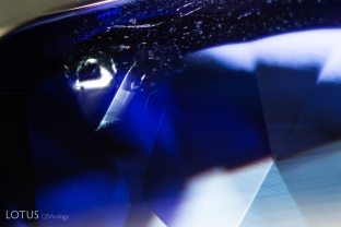 A shiny fissures is visible where a negative crystal was blown out in this heated tanzanite.
