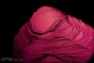 Stepped growth on the surface of a natural ruby crystal from Mogok, Burma.
